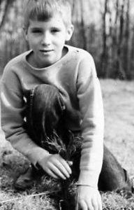 00-00-0000 Boy kneeling on ground. Photo by Robert Mills