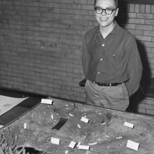 00-00-0000 Boy standing behind soil model. Photo by Robert Mills