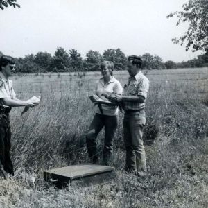 00-00-0000 Game official holding bird as 2 other people holding birds look on-website