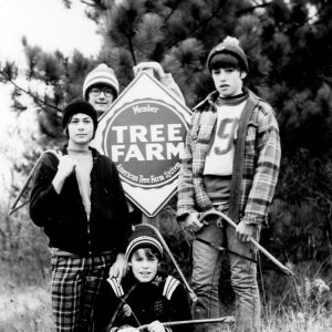 00-00-0000 Group of four posing with Tree Farm sign.Photo by Robert Mills