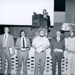 00-00-0000 John Scherer, podium. Right-Bob Neise,Steve Schroder________John Adams-website