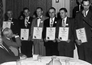 00-00-0000 Leo Durante,Homer Billman, J.H. Graves, Leo Dietisch, Lester Endsley, Cecil Robinson, Wm. Tebbe receving award fron L.L. Rummell, Chm State Committee. Photo by