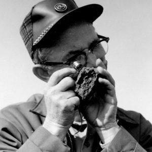 00-00-0000 Man looking at soil through magnifying glass. Photo by Robert Mills