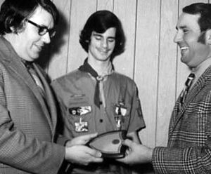 00-00-0000 Two men handing plaque to a boy scout. Photo by Robert Mills