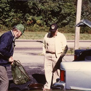 00-00-0000 Two men putting fish in bucket-website copy