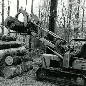 03-20-1969 Ronnie Dunn of Brenemen Brothers Lumber Co. Piling logs at the Wayne Stewart 24 acre tract of timber#1-website