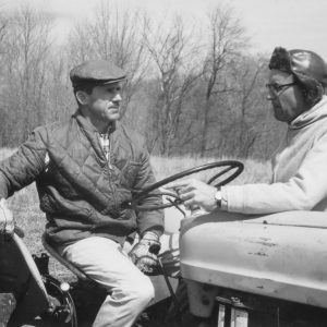 04-03-1967 E.Leedy on tractor & Dean Swigart in a field-Photo by Robert Mills