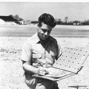 05-06-1964 Soil Scientist C.Edward Redmond drawing boundary lines on aerial photograps.Photo by Robert Mills