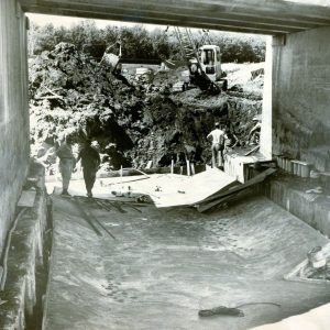 06-22-1964 Ben Van Zoest,contract supervisor for the Celeryville Conservancy District checks bridge floor construction-0001