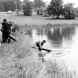 06-25-1975 A Madison Fire Dept pumper secures a water supply from pond at Rural Life Center-website