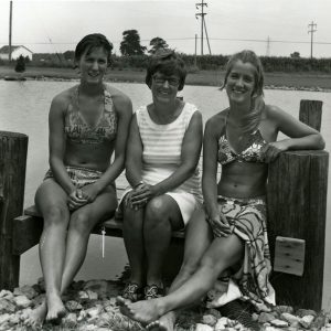 07-15-1975 Mrs. Metzger and daughters at half acre pond belonging to the family-website