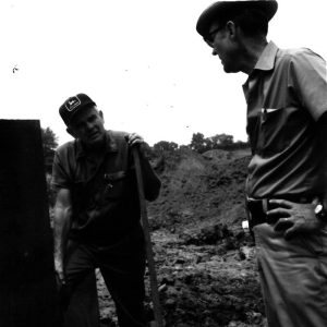 07-17-1975 Dan Cooper and Dean Swigart discussing pipe at Bill Evans Pond-website