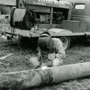 08-12-1968 David Rogers welding mechanical outlet structure for pond at Rev.Ben Lewis Farm. Troy Twp-website