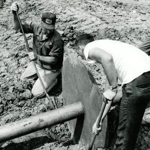 08-14-1970 Marlin Cole, Contractor & owner Ray MCFerrer Jr with Dean Swigart as the hooded inlet is installed-website