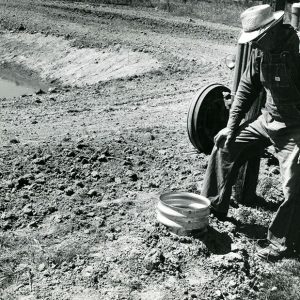 08-30-1968 Doyle McCarron at the new fire protection inlet at his farm pond-website