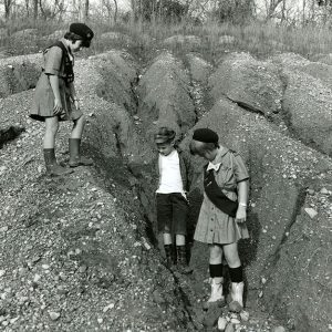 11-00-1968 L-R. Terry,Tom & Cindy Jackson.Eroded area where 300 Boy & Girl Scouts planted trees. See back for more info-Website