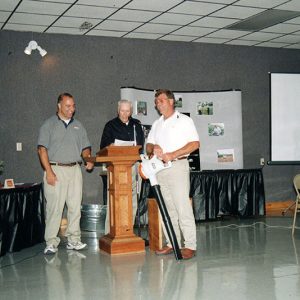 2000 Annual Meeting George Fackler & LaVaughn Oswalt present to Jerry Schumacher-website