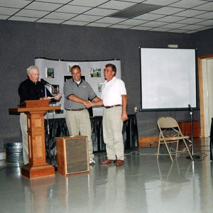 2000 Annual Meeting Lavaughn Oswalt & George Fackler present to Jerry Schumacher-website