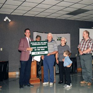 2000 Cooperator of Year. Dale Hulit, Supervisor presents to Kent Adams-website