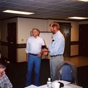 Dick Forbes, Eric Basin. Receiving Award Gary Small-website