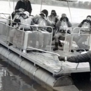 Group of students on pontoon boat. Photo by Robert Mills