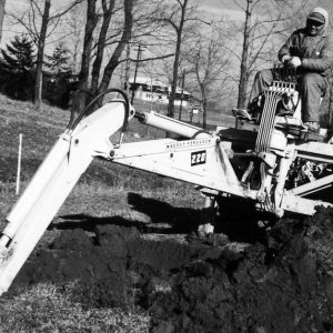 Man on back hoe digging .Photo by Robert Mills (2)