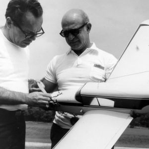 Two men with model airplane .Photo by Robert Mills