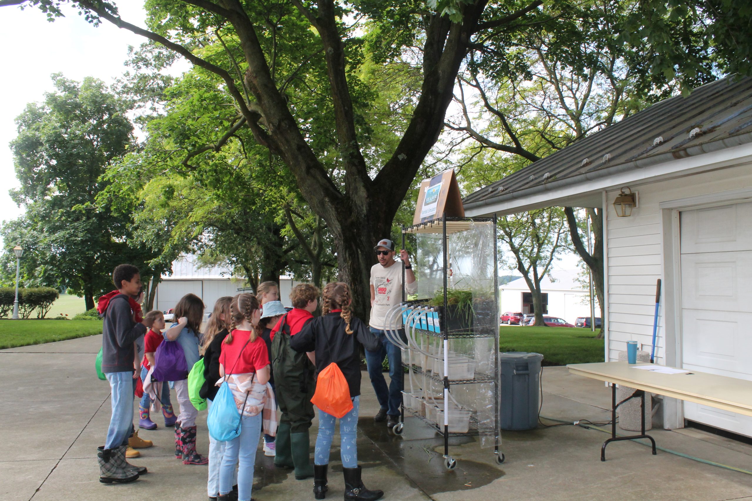 Technician Jordan Keller with the rainfall simulator.