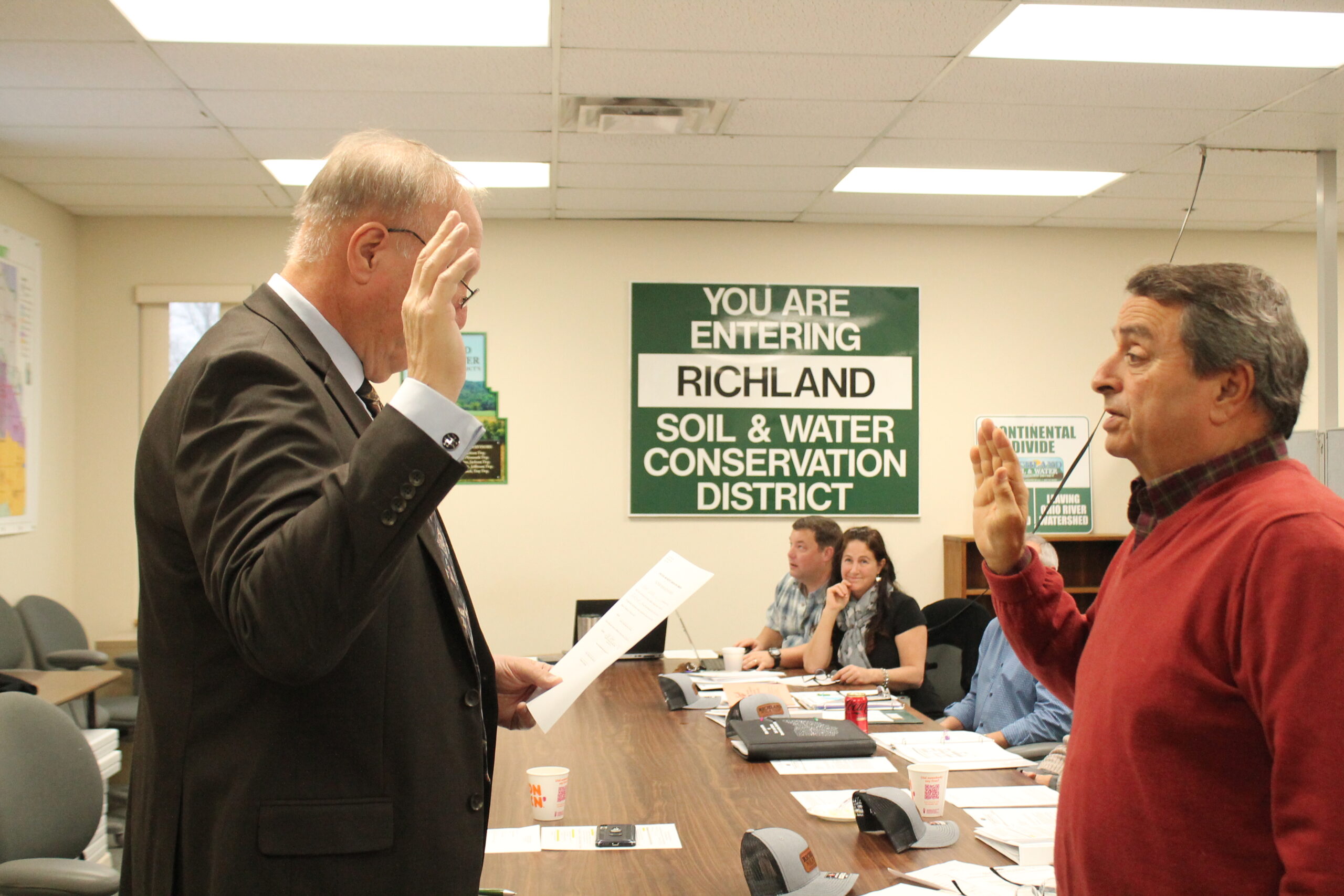 Commissioner Cliff Mears swearing in Fred Cooke
