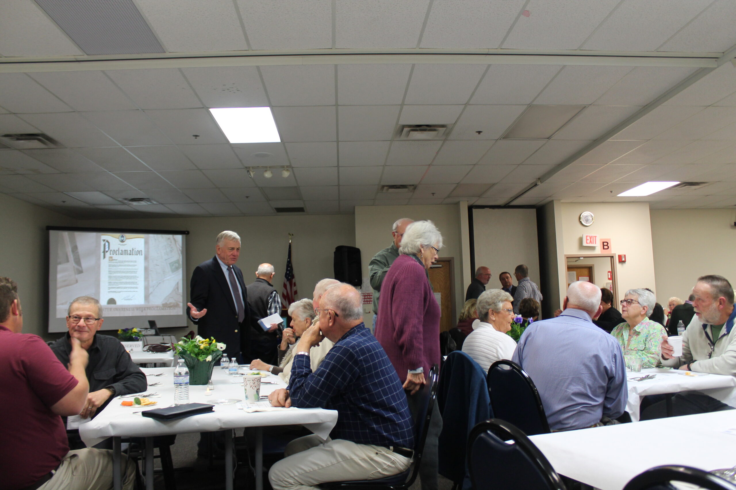 Denny, Guy in coat and tie; Brenner, Candy Richland SWCD volunteer in sweater