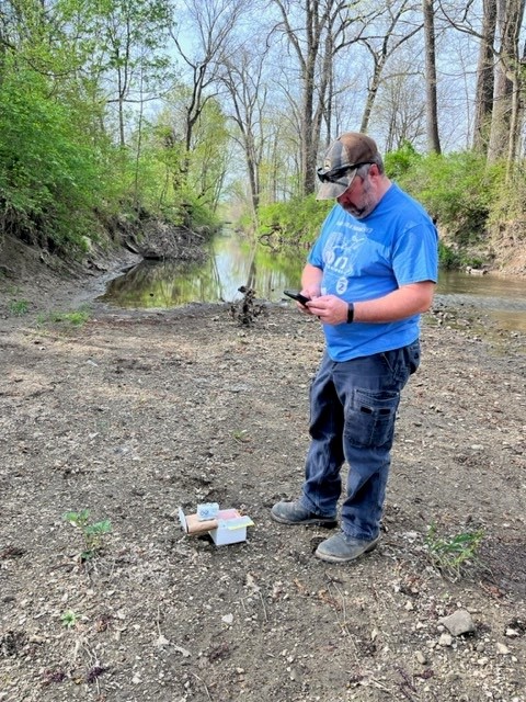 Matt, SWCD Technician taking control sample upstream