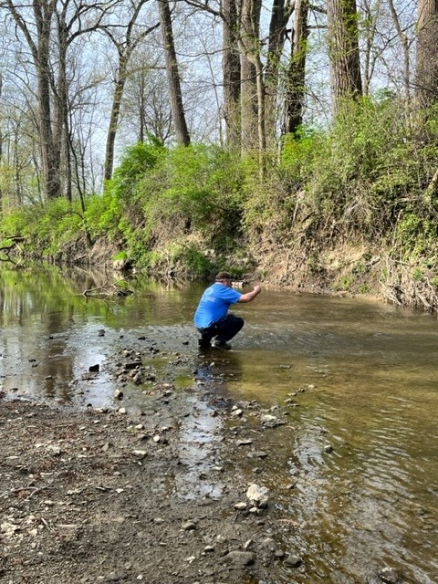 Matt, SWCD Technician taking downstream sample