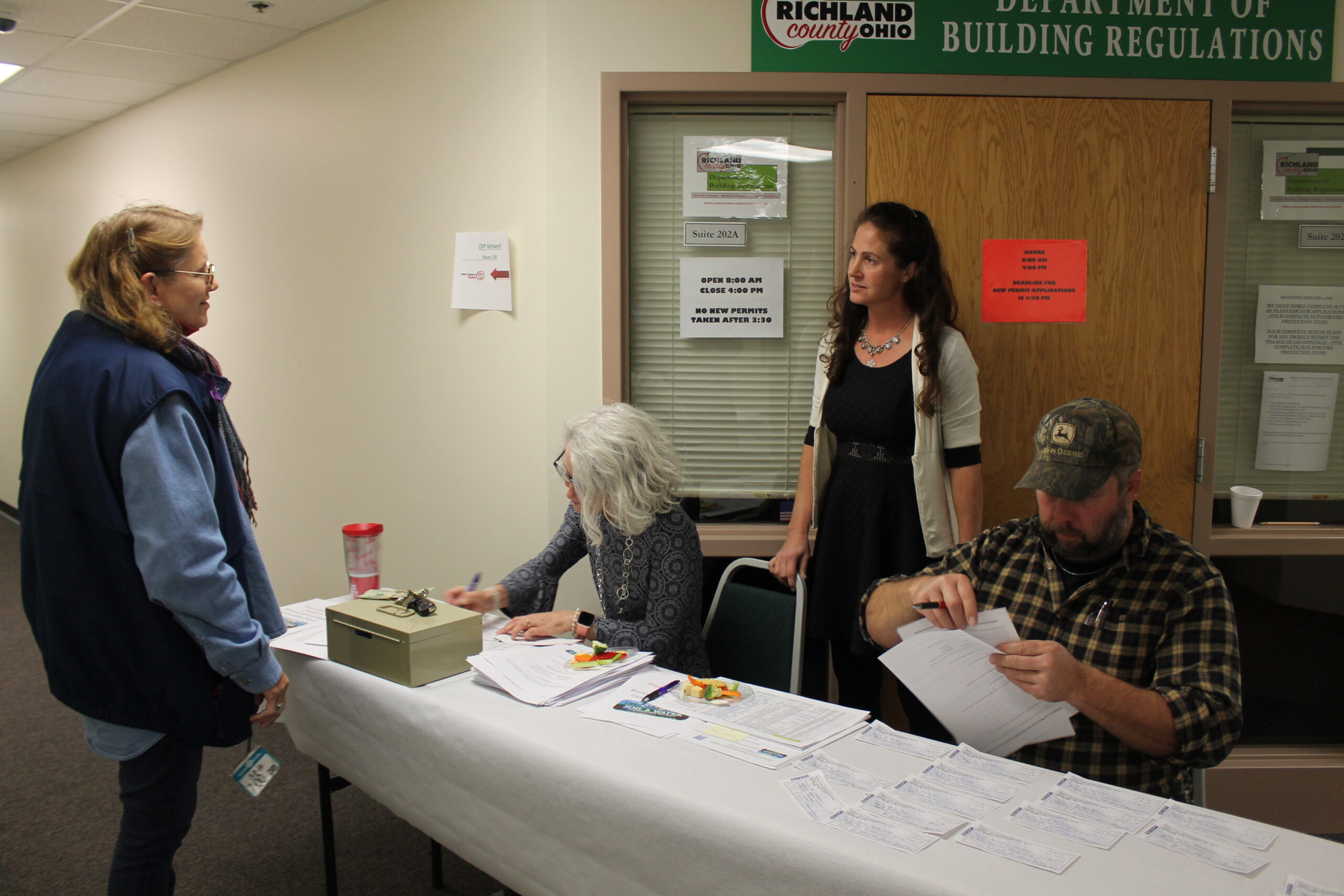 McClintock, Jean in front of table; L to R Sutter, Theresa, Thomas, Erica, Wallace, Matt Richland SWCD
