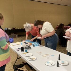Participants_Gathering_Supplies Gotter, Brenda; Gotter, Karen; Gotter, Jess; Kent, Abigail_on_left_side_of_table