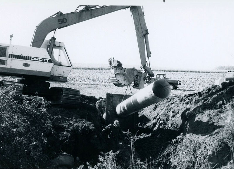 Crane lifting drainage pipe into place
Photo ID#: A1031