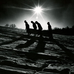 00_00_0000_Four_people_carrying_toboggan_up_hill_Silhouetted_website-2998