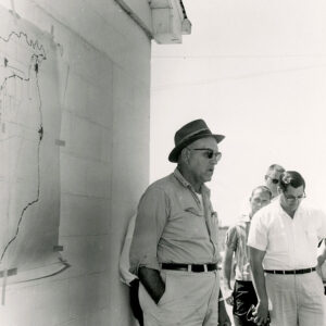 00_00_0000_Four_unidentified_men_near_building_with_map_website-5341