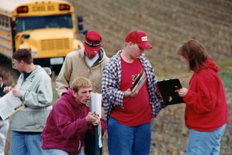 Student checking slope of land
E493