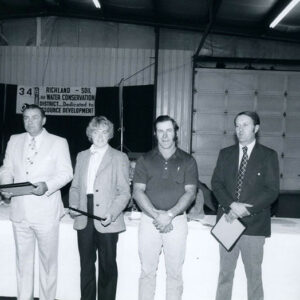 00_00_0000_Group_of_4_men___1_woman__standing_with_awards_in_hands_website-5741
