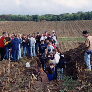 00_00_0000_Group_of_students_in_field_some_in_trench_2_Website-5609