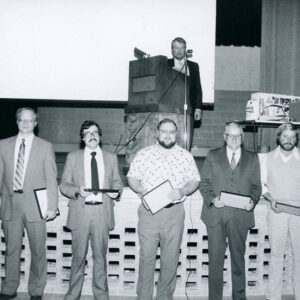 00_00_0000_John_Scherer__podium._Right_Bob_Neise_Steve_Schroder________John_Adams_website-5718