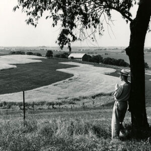 00_00_0000_Man_leaning_against_tree_looking_at_contour_strip_fields_website-466