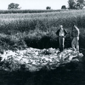 00_00_0000_Two_men_looking_at_pile_of_rocks_near_field_website-5243