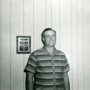 00_00_0000_Unidentified_man_posing_beside_plaque_1_Website-5810