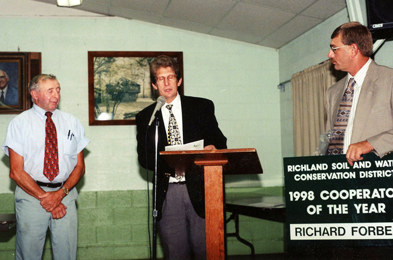 1998 Annual Meeting
Richard Forbes, Charles Winger and Ken Burren presenting Richard Forbes the Goodyear Cooperator of the Year Award 
Photo ID#: RSWCD639