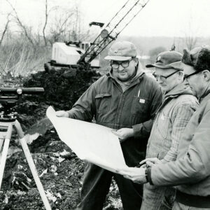 01_16_1969_Bob_Wilson__Richard_Holmes___Dean_Swigart__SCS_Techniciian_as_the_farm_owners_check_out_construction_progress_on_the_group_job_website-495