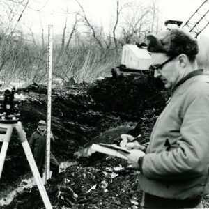 01_16_1969_Dean_Swigert__SCS_Technician__as_he_checks_out_the_Holmes_Group_Open_Ditch._Robert_Wilson_is_on_the_rod_website-496
