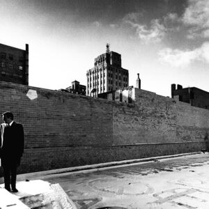 01_23_1972_John_W._Cook_Jr._sec_treas_H.L.Reed_Co._in_new_parking_lot_the_former_site_of_R.B._Maxwell_Co._destroyed_in_1969_fire_website-3116