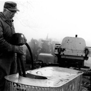 03_12_1976_Leo_Fair_pulls_the_pump_from_his_sap_gathering_tank_website-1099