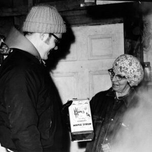 03_14_1972_Forbes_Sugar_House._Mrs._Randall_Forbes_sr__with_Norman_Widman._Maple_Sugar_Sales_website-1101